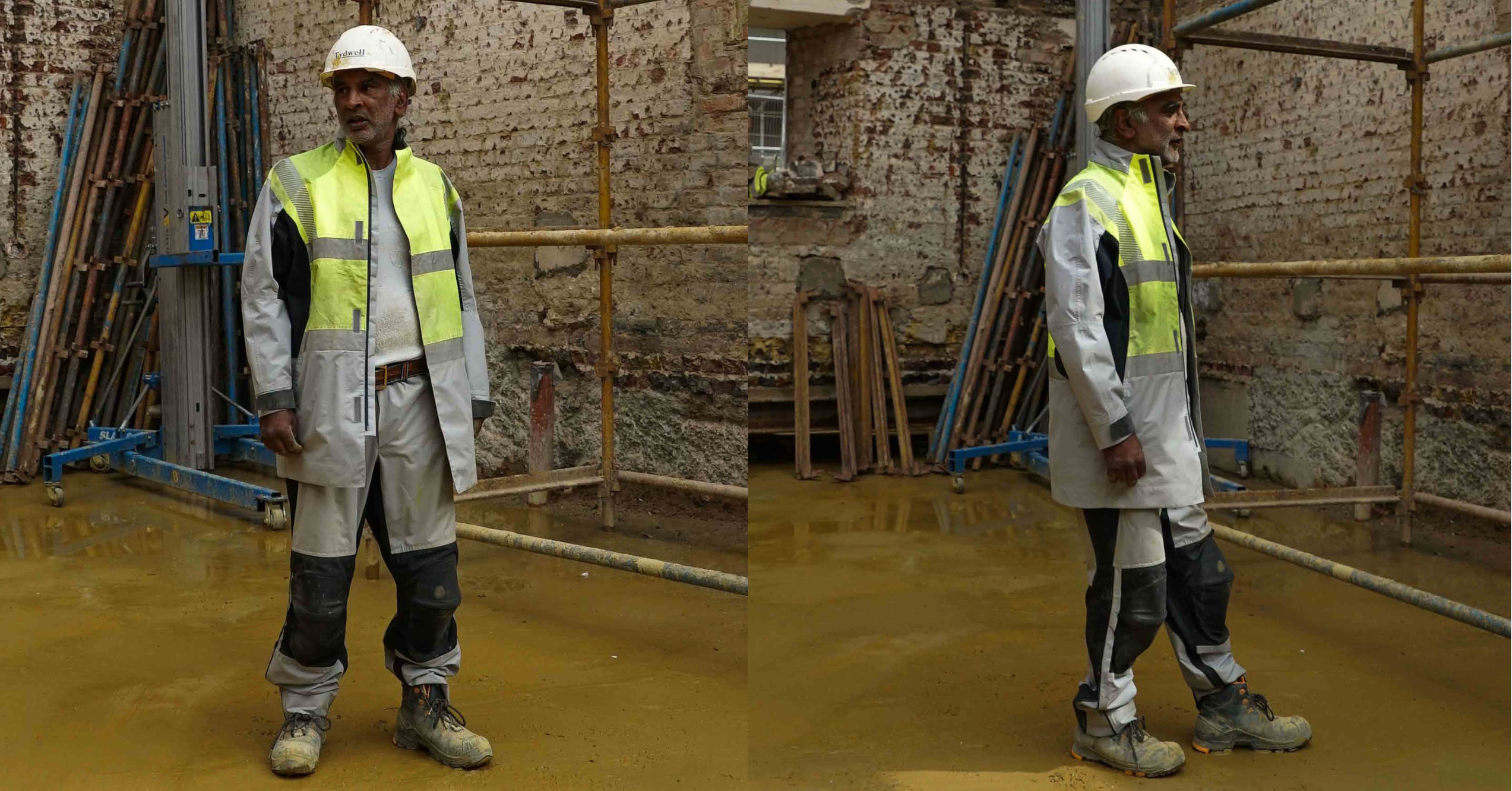 TMS.SITE uniform customization: a man is wearing an example of a customized set of TMS.SITE workwear, including jacket and pants.